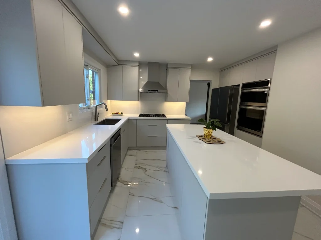 Grey custom kitchen cabinets with a quartz island
