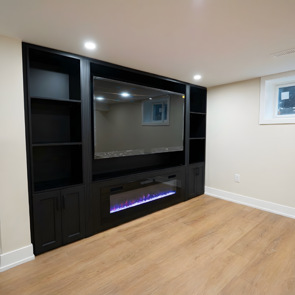 Finished basement with a black built-in and fireplace
