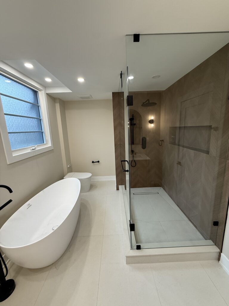 Bathroom with a glass walk-in shower and freestanding tub